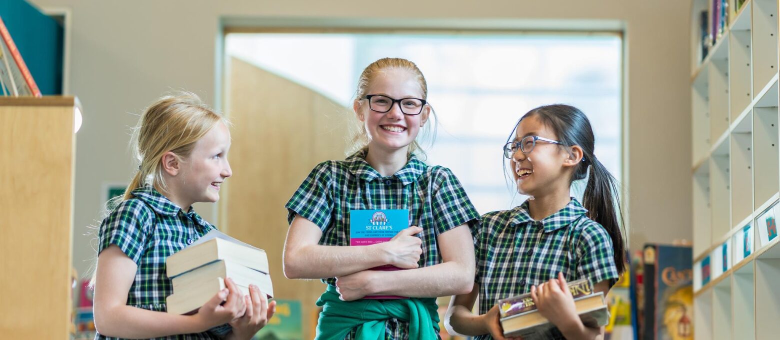 girls holding books