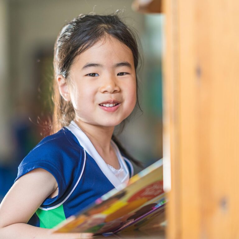 girl holding a book