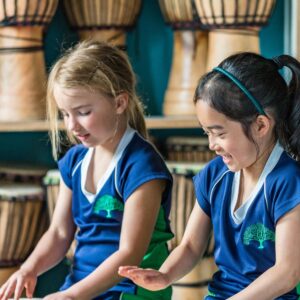 2 girls playing the drums