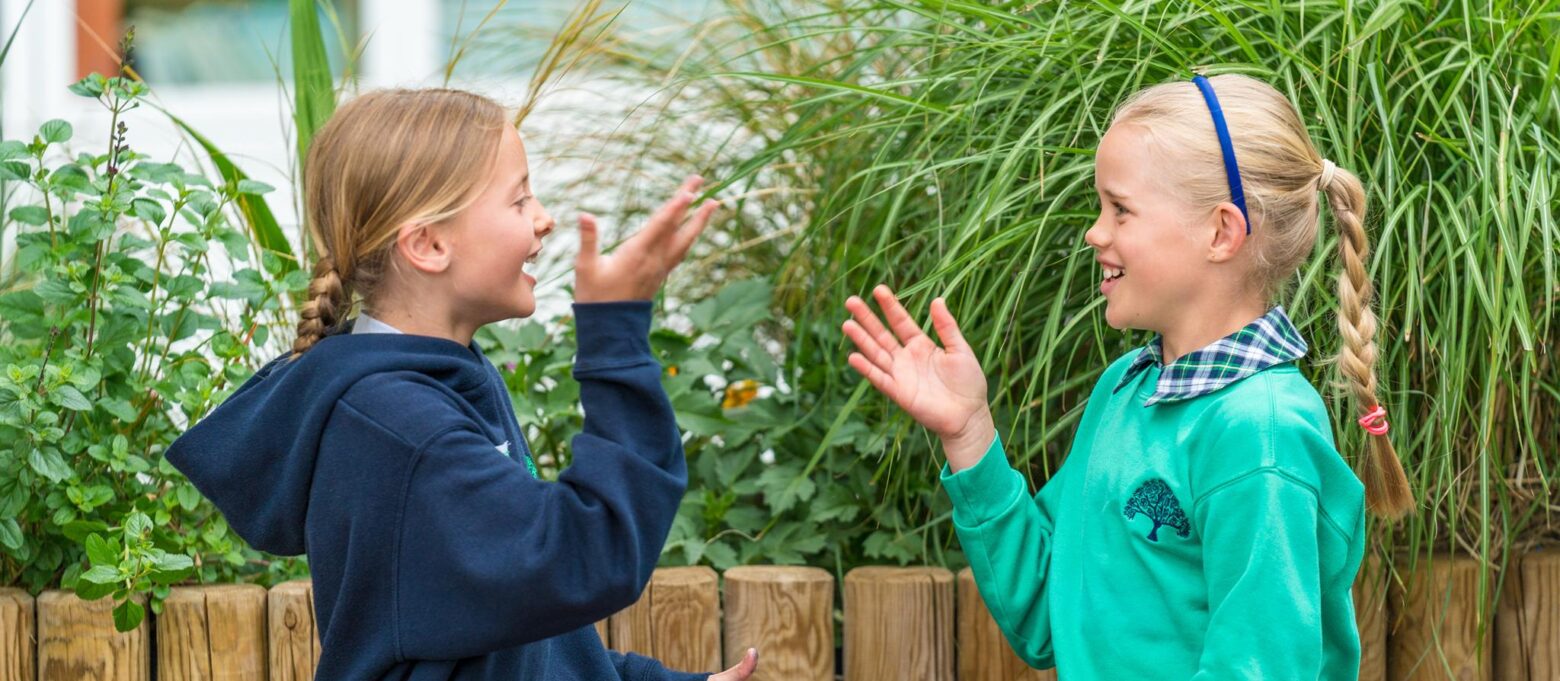 girls playing a clapping game