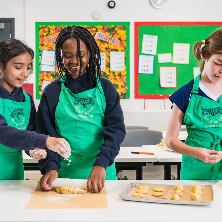 3 girls making cookies